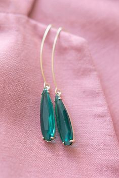 Emerald Green Pendant Earrings ⟡ all items are designed and handcrafted in our studio ⟡ Long green glass and gold teardrop earrings. Introducing our emerald pendant earrings - a stunning addition to any jewelry collection. They feature a beautiful glass stone set in a gold plated setting, creating a perfect balance of elegance and luxury. The long ear wire adds a dramatic touch to any outfit, making them perfect for both formal and casual occasions. OVERVIEW-3" in length-glass crystals-gold plat Gold Threader Earrings, Bridal Bouquet Charms, Gold Teardrop Earrings, Threader Earrings Gold, Bouquet Charms, Green Pendant, Green Pendants, Emerald Pendant, Bridal Bracelet