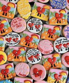 many decorated cookies are displayed on a table