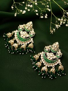 Introducing our stunning big emerald green kundan earrings - the perfect statement piece to add a touch of glamour and sophistication to any outfit. These earrings are meticulously crafted with intricate detailing and feature vibrant emerald green kundan stones that catch the light beautifully, creating a stunning sparkle effect that is sure to turn heads. These earrings are perfect for any occasion, whether you're dressing up for a special event or want to add some sparkle to your everyday look. They're versatile and can be dressed up or down, making them perfect for any outfit. These earrings are made with high-quality materials, ensuring durability and longevity. They're lightweight and comfortable to wear, so you can wear them all day without any discomfort. If you're looking for a sta Pink Eye Makeup, Pakistani Wedding Outfits, Classical Dance, Fancy Jewellery Designs, Dance Jewelry, Earrings Indian, Kundan Earrings, Ethnic Earrings, Fancy Jewellery