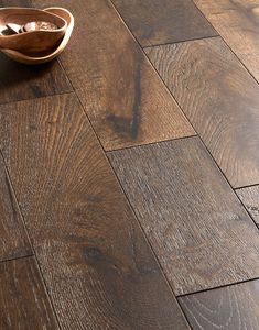 a wooden floor with a bowl on top of it