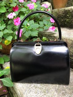 "Thank You If You Favored One of My Items! You Will Receive 10% Off an Item of Your Choice, Unless It Is On Sale, Code17. Thank You. RARE 60's WATCH HANDBAG/60's Handbags/60's Purses/Watch Handbags/Collectible Handbag/Black Handbag/Black Purse/Rare Purse/Near Mint Condition RARE Cira 60's WATCH HANDBAG Bag by Triangle New York This is a Rare 1960's Watch Handbag in Black Leather.  It is a True Classic Top Handle Leather Handbag.  The Hardware and the Watch are all in Gold Tone Metal.   Measureme 60s Purse, Rare Handbags, Swiss Watch, Printed Purse, Black Handbag, Top Handle Bags, Black Purse, Vintage Purses, Handbag Black