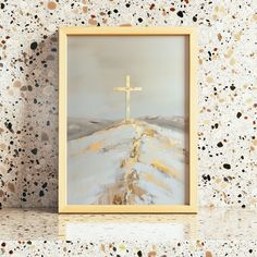 a painting of a cross on top of a hill in front of a white wall