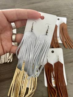 Metallic tassel earrings 4” long •FINAL SALE• Adjustable Silver Tassel Earrings For Party, Trendy Adjustable Chandelier Dangle Earrings, Silver Dangle Tassel Earrings, Long Drop Fringe Tassel Earrings, Trendy Fringe Drop Earrings, Trendy Silver Fringe Jewelry, Trendy Silver Tassel Drop Earrings, Chic Silver Tassel Earrings, Silver Dangle Tassel Earrings With Fringe