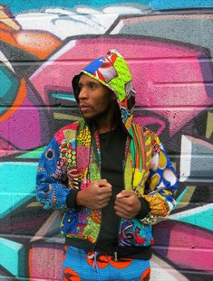 "Festival Jacket, African Print Jacket, Hippie Jacket COLOUR ME CRAZY HOODIE - These crazy colourful patchwork jackets are made from 100% recycled fabrics.  A real rainbow jacket that will mean you never get lost in a festival field and will turn heads on the city streets!   - African print jacket/ hoodie - Unisex design - Made from 100% recycled patchwork fabric - Lined for additional warmth - Black stretchy cuffs and waist for comfy fit - Big pockets - Matching COLOUR ME CRAZY hats, trousers a Cotton Patchwork Windbreaker For Streetwear, Streetwear Cotton Hooded Jacket With Patchwork, Cotton Patchwork Hooded Jacket For Streetwear, Casual Multicolor Hooded Jacket For Streetwear, Funky Multicolor Winter Outerwear, Urban Patchwork Windbreaker For Streetwear, Multicolor Hooded Jacket For Streetwear, Multicolor Streetwear Hoodie, Multicolor Hooded Windbreaker For Streetwear