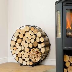 a stack of logs sitting next to a fire place