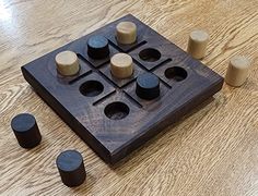 a wooden board game with several pieces on the floor