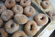 there are many sugar donuts on the tray