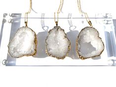 Natural quartz crystal geode necklace. This necklace features a 24k gold plated brass chain along with a stunning, natural gold plated quartz crystal geode. Quartz cleanses and purifies any space or object and it also raises the vibration and manifestation abilities either of its wearer, or of other natural stones. *Please note we have a small batch of these, and they are all gorgeous - but each is unique. So yours will be a little different than the picture, but wonderful - we guarantee it or y Gold Crystal Necklace With Raw Stone For Gifts, Gold Crystal Necklace With Raw Stone As Gift, Gold Jewelry With Large Stone For Gift, Healing Gold Necklaces With Raw Stone, Gold Crystal Necklaces With Natural Stones As Gift, Gold Gemstone Crystal Necklace For Wedding, Gold Crystal Gemstone Necklace For Wedding, Elegant Gold Crystals For Gift, Gold Mineral Crystal Spiritual Necklace