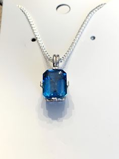 Lovely Sterling Silver Swiss Blue Emerald Cut Topaz Pendant Necklace Approximately 3.8 Carat Stone / 8x10 mm All Components are Sterling Silver 18" Sterling Silver Box Chain Excellent Good Condition  Natural tarnish may exist from storage Thanks for viewing this item! Blue Emerald, Topaz Pendant, Silver Box, Swiss Blue Topaz, Sterling Silver Necklace Pendants, Silver Pendant Necklace, Box Chain, Sterling Silver Pendant, Emerald Cut