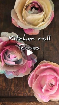 three paper flowers with the words kitchen roll roses