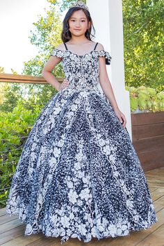 Your sweet girl will look timeless in this floral print long off the shoulder dress with A-line skirt by Cinderella Couture 8070. This beautiful ballgown features a cold shoulder sweetheart bodice embellished with floral embroidery, open lace-up back with a zipper closure, and a floor length A-line skirt with a sweep train. Matching women's dress sold separately: Style 8070J. Girls Floral Print Off Shoulder Gown by Cinderella Couture 8070 Designer: Bliss by Cinderella Couture Fabric: Glitter Tulle, Floral Embroidery, Beaded Embellishments, Polyester Please note: There may be a loss of glitter while wearing this dress due to the nature of the fabric Colors: Blue, Black Sizes: 2, 4, 6, 8, 10, 12, 14, 16 Occasions: Pageant, Flower Girl, Junior Bridesmaid, Formal Event, Wedding Guest, Holiday, Floral Print Ball Gown Evening Dress, Off-shoulder Dress With Fitted Bodice For Quinceanera, Fitted Bodice Off-shoulder Dress For Quinceanera, Floral Print Fitted Ball Gown, Floral Print Ball Gown With Fitted Bodice, Off-shoulder Ball Gown For Prom Pageant, Fitted Off-shoulder Evening Dress For Quinceanera, Fitted Off-shoulder Dress For Pageant, Fitted Off-shoulder Dress For Pageants