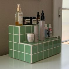 a counter with some bottles and containers on it