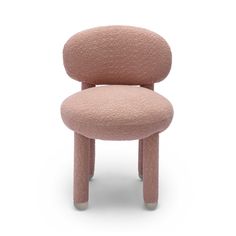 a pink chair that is shaped like an egg