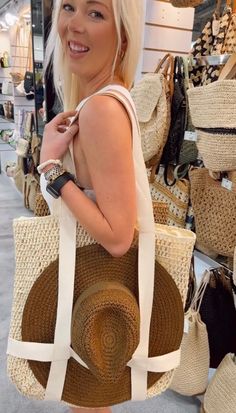 Carry your hat, hands free! The best way to carry your hat. Two straps secure the brim on either side. It’s beautiful + smart! This is hat-transportation made chic. Bring California vibes wherever you go with this boho straw bag. Also has interior pockets for quick organization. Makes the perfect birthday, graduation or Mother’s Day gift! - 18” x 18” • Top zip closure• Shoulder straps• One interior wall pocket and zip pocket• Lined• Paper straw/polyester Chic Straw Hat For Travel And Beach Season, Chic Straw Hat For Beach Season Travel, Bohemian Beige Straw Hat For Travel, Chic Straw Sun Hat For Travel, Trendy Travel Sun Hat With Short Brim, Trendy Straw Sun Hat For Travel, Trendy Sun Hat With Short Brim For Travel, Summer Panama Hat For Beach Season Travel, Trendy Short Brim Sun Hat For Travel