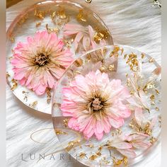 two clear plates with pink flowers on them