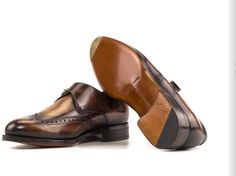 a pair of brown shoes on top of each other