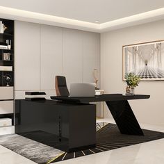 a black desk with a laptop on it in front of a bookcase and bookshelf