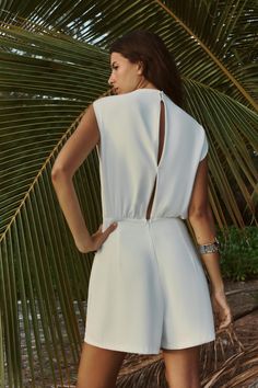 Let's grab a drink and soak up the sun in the Moment for Life White Wrap Romper this summer! Features high O-neckline, sleeveless bodice, gathered pleats at one shoulder with button-loop closures at the back The blousy waist sits atop a faux wrap skort with chic black piping and a relaxed silhouette Made from quality polyester fabric Comes in sizes S-L Available in One- Color only Model is wearing size S Sleeveless Playsuit, Wrap Skort, Pullover Women, Wrap Romper, Business Dresses, Sleeveless Jumpsuits, High Fashion Street Style, Contrast Trim, Women Dress