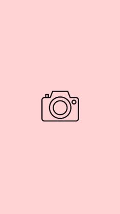 a camera on a pink background