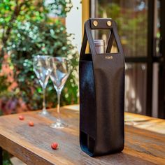 a wine bag sitting on top of a wooden table