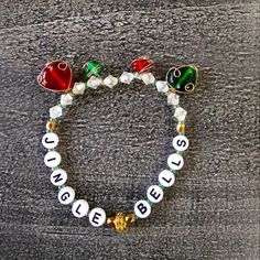 Ring In This Holiday Season With A Beautiful Sparkle Plenty Handmade "Jingle Bells" Bracelet. Glass Beads Wrapped In Gold Wire And A Crystal Spacer Adorn This Sparkly Red And Green Accented Bracelet. Jingle Bell Bracelets, Christmas Beaded Bracelets, Bells Bracelet, Winter Bracelet, Holiday Bracelets, Bead Projects, Word Bracelet, Inspirational Bracelets, Christmas Bead