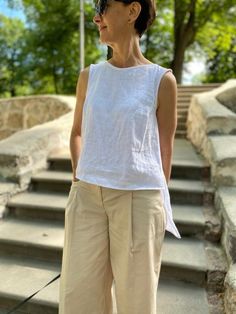 Want to feel comfortable on a hot day? Choose linen clothes! CARE FOR LINEN - Machine wash up to 30ºC/86ºF gentle cycle - Lay flat to dry or tumble dry low - Warm iron if needed - Do not bleach ON THE PHOTO:  Height of model - 161 cm  Model wearing size XS/S.  Best for waists: 26 - 27 inch (66-69 cm). Best for hips: 36 -3 7 inch (91-94 cm). Length: front of 19 inch (48 cm) / back 26 inch (65 cm) Color of top - PEARL WHITE SIZE CHART: * Please note that all garment measurements are approximate as Casual Relaxed Fit Tank Top For Daywear, Relaxed Sleeveless Top For Beach, Relaxed Sleeveless Tank Top For Spring, Casual White Linen Tank Top, Summer Sleeveless Relaxed Fit Tank Top, Relaxed Spring Tank Tops, Relaxed Sleeveless Summer Top, White Relaxed Fit Tank Top For Beach, White Sleeveless Linen Top