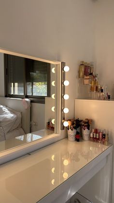 there is a vanity mirror with lights on it