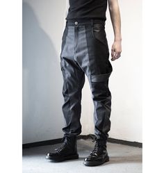 Dark gray & black pants designed with fake leather stripes, pockets front and back. Normal wash. Collection 'DISTRESSOR' Spring '21 Avant-garde Black Pants For Streetwear, Avant-garde Baggy Black Pants, Avant-garde Black Baggy Pants, Alternative Style Black Pants With Multiple Pockets, Black Alternative Pants With Multiple Pockets, Alternative Black Pants With Multiple Pockets, Mens Futuristic Fashion, Futuristic Clothing Men, Men Cyberpunk