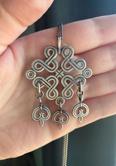 Gorgeous vintage Kalevala Koru necklace. Stunning pendant made by Finish silversmiths Kalevala Koru, with full hallmarks and makers makes on the reverse, for the year 1944! 813 silver grade. Chain is not original, but is 925 silver and sits at 26 inches length. One of the rarer designs. A timeless piece with a touch of Viking. Condition: Great vintage  Weight: 16.24 grams (with chain) Letter Symbols, Ancient Designs, Viking Style, Timeless Pieces, Pendant Necklaces, Wire Wrapped, Vikings, Favorite Jewelry, Jewelry Necklace Pendant