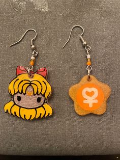 Hanging resin and bead earrings hand painted. Sailor Venus  face Orange Dangle Resin Earrings, Handmade Plastic Dangle Earrings, Orange Resin Dangle Earrings, Artsy Resin Dangle Earrings, Artsy Resin Earrings With Ear Wire, Cute Hand Painted Resin Earrings, Hand Painted Resin Drop Earrings, Hand Painted Resin Earrings In Artsy Style, Hand Painted Resin Earrings