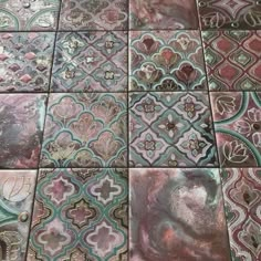 several different colored tiles with designs on them