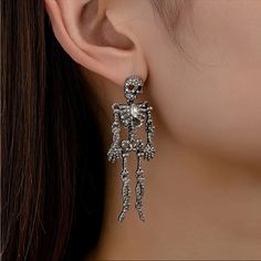 New In Package Color: Silver Rhinestone Skeleton Earrings, Rhinestone Skull Earrings, Halloween Earrings Elegant Metal Halloween Earrings, Elegant Metal Earrings For Halloween, Gothic Skull Earrings For Party, Punk Skull Earrings For Party, Silver Skull Earrings For Halloween, Nickel-free Skull Jewelry For Party, Skull-shaped Metal Earrings, Silver Skull Shaped Single Earring, Single Earring For Halloween Party