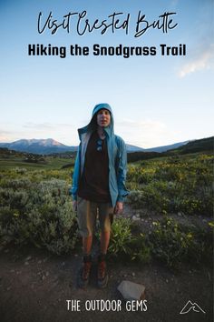 a man standing in the middle of a field with text overlay that reads, visit crested butte hiking the snodgrass trail