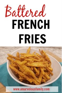 a white bowl filled with french fries on top of a table