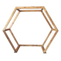 a wooden hexagonal object on a white background