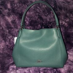 Coach Shoulder Bag, Brand New With Tags. New/Limited Color Of Dark Teal. Plenty Of Room To Carry What You Need And Some Things You Don’t. Zipper In The Middle And Clasps For Each Side. Ladies Fall In Love With This Bag And Make Me An Offer. Thanks For Checking Out My Page. Luxury Green Bucket Satchel, Elegant Green Bags For Errands, Elegant Green Hobo Bag With Double Handle, Elegant Green Satchel Hobo Bag, Elegant Green Hobo Shoulder Bag, Elegant Green Top Handle Hobo Bag, Green Formal Bucket Bag, Formal Green Bucket Shoulder Bag, Coach Designer Green Bag