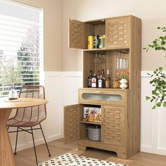 a wooden cabinet with bottles and glasses on it