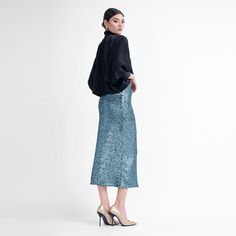 Introducing our stunning Sequin Midi Skirt, a glamorous addition to your wardrobe that radiates elegance and allure. This midi-length skirt is adorned with intricate sequin detailing, creating a mesmerizing and eye-catching allure. The concealed rear zip fastening ensures a seamless look while allowing for easy wear. Lined for comfort and crafted with a medium-stretch fabric, this skirt offers both style and flexibility. The conical fit accentuates your figure gracefully, creating a sleek and so Sequin Midi Skirt, Green Sequins, Midi Length Skirts, Green Skirt, Fashion Jewellery, Independent Designers Fashion, Jacket Sale, Gifts For New Moms, Easy Wear