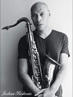 a man holding a saxophone in his hands