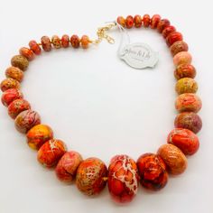 Gorgeous Orange Stone Necklace New With Tags By Iris & Lily London. Signed Luc 925. Large Graduated Polished Orange Jasper Stone Beads. Necklace Is Hefty And Solid Quality. A Miniature Mannequin Is Used For Photos. Luxury Orange Necklace With Natural Stones, Miniature Mannequin, Orange Agate Necklace With Polished Beads, Artisan Orange Gemstone Necklace, Cheap Orange Multi-strand Necklaces, Stone Beads Necklace, Nails Pendant, Lily Jewelry, Orange Agate Hand-strung Beaded Necklaces