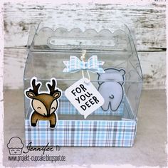 a clear box with a deer and bear sticker on the front that says for your deer