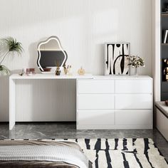 a bedroom with a bed, dresser and mirror on the wall next to a window