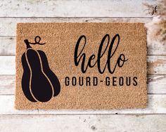 a door mat with the words hello gourd - geous on it and an eggplant