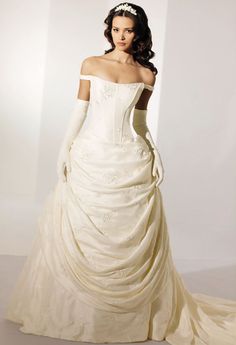 a woman in a wedding dress with gloves on