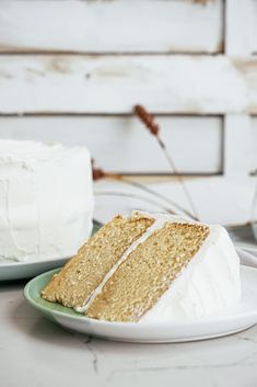 a slice of cake sitting on top of a plate next to another piece of cake