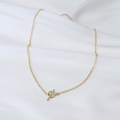 "14K Gold Toggle and Rolo chain necklace *The chain, toggle clasp and all components are 14K yellow gold (If you order a 16\" necklace, it will be a toggle clasp plus chain will be 16\".) The toggle clasp is about 12mm. 2.3mm Rolo chain Please read our policies before you place your order. https://www.etsy.com/shop/SashJewelry/policy?ref=shopinfo_policies_leftnav To see other Mother daughter necklace set click here: https://www.etsy.com/shop/SashJewelry?section_id=12441134&ref=shopsection_le Everyday Gold Lariat Necklace With Lobster Clasp, Gold Oval Link Toggle Necklace With Adjustable Chain, Gold Link Toggle Necklace With Delicate Chain, Gold Minimalist Chain Link Toggle Necklace, Gold Minimalist Toggle Chain Link Necklace, Classic Toggle Necklace With Oval Link Cable Chain, Gold Chain Link Toggle Necklace In Minimalist Style, Dainty Gold Toggle Necklace With Lobster Clasp, Gift Toggle Necklace With Delicate Chain