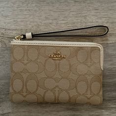 Never Used! Brand New Coach Wristlet! 6 Inches Long, 4 1/4 Inches Tall Cream Pouch Wristlet For Gift, Cream Pouch Wristlet As Gift, Chic Beige Wristlet For Gift, Chic Beige Wristlet As A Gift, Elegant Cream Bag With Wrist Strap, Elegant Beige Wristlet For Travel, Cream Pouch Wristlet Gift, Chic Cream Wristlet For Everyday, Elegant Beige Clutch With Wrist Strap