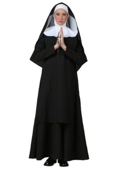 a woman in a nun costume standing with her hands together