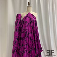 This beautiful Italian silk jacquard is made of 100% silk. Bold and unique in color, this designer fashion fabric is perfect for anyone with an affinity for silk's gorgeous drape and luster. Its billowy drape is ideal for skirts, blouses, pants, scarfs and anything garment that emphasizes its lovely fluid drape. Content - 100% Silk Color - Purple, Black Width - 55" Fabric Not Reorderable Made in Italy **Please note: the image of the fabric on the mannequin is true to color. Elegant Jacquard Fabric For Evening, Elegant Purple Silk Fabric, Elegant Silk Fabric For Spring, Elegant Silk Fabric For Evening, Fitted Silk Fabric For Party, Elegant Evening Silk Fabric, Elegant Silk Fabric With Satin Finish, Elegant Silk Fabric Traditional Drape, Elegant Silk Fabric In Traditional Drape