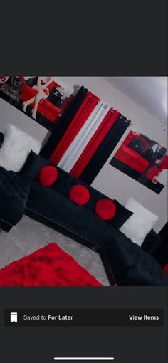 a living room with red and black furniture